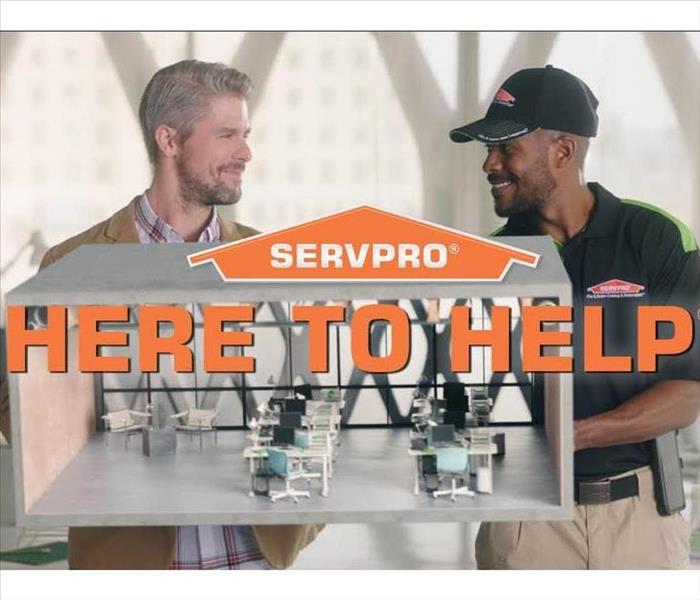 SERVPRO technician with customer 